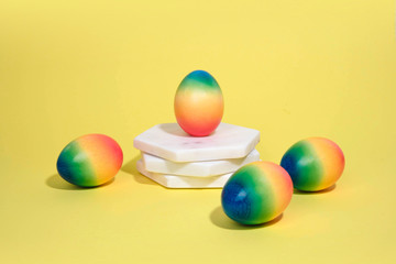 Painted eggs on pastel background.