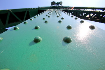 A beautiful old green bridge with steel structures. © Apichart