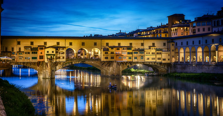Evening view of the famous bridge Ponte Vecchio on the river Arno in Florence, Italy.