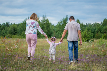 happy family with children running 