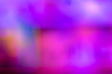 Defocused photo in blue and pink tones. Abstract blurred background. Space for lettering or design