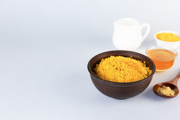 Ingredients for making Golden milk on a gray table. Masala Haldi Doodh. The concept of alternative medicine