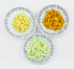 Cabbage,pumpkin and potato slashed in to small pieces and arranged in three plates