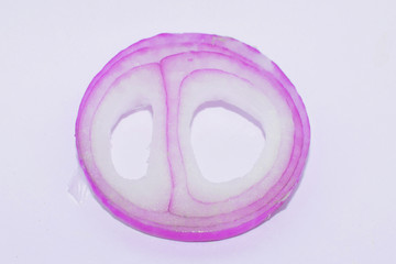 Close up picture of a pink colored medium sized onion ring in the middle of a white background