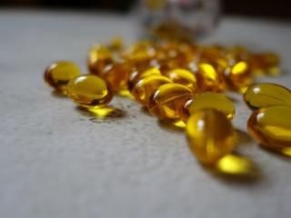 layout of yellow gelatin capsules filled with fish oil-omega 3