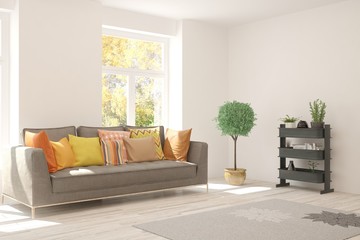 Stylish room in white color with sofa and autumn landscape in window. Scandinavian interior design. 3D illustration