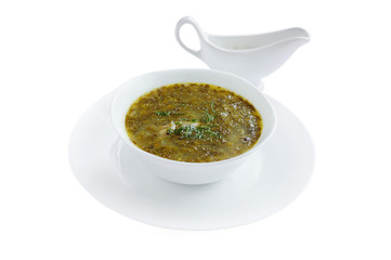 Soup with sorrel, meat and eggs, called green borsch.