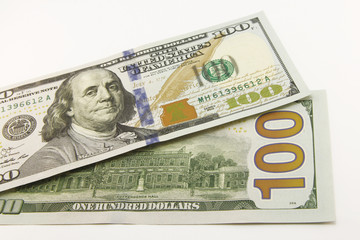 One hundred dollar cash banknotes on white background