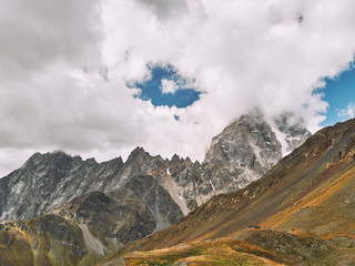 View of Ushba mountain covered by cloud in Svaneti region of Georgia