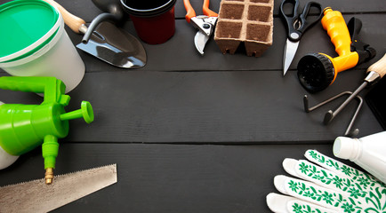 A lot of different garden equipment on the wooden table