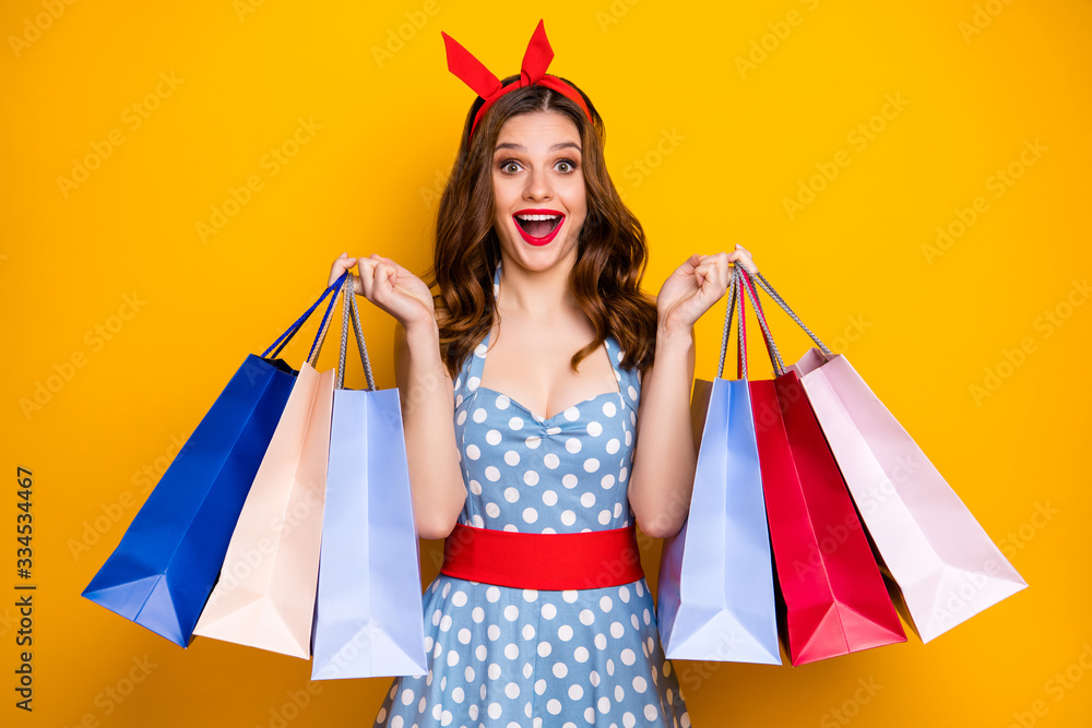 Poster crazy surprised energetic girl addicted shopper enjoy off-sales discounts impressed scream omg show 