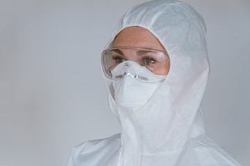 Female doctor wearing  protective suit to fight coronavirus pand