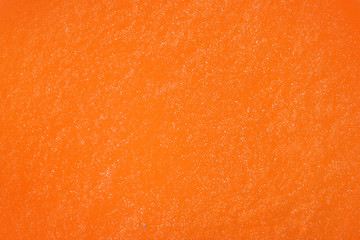 Closeup view of orange slime as background. Antistress toy