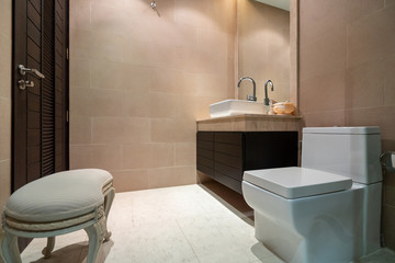 Sink, toilet and shower in bathroom of villa, house, home, condo and apartment