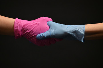 Man And Doctor Holding Hands Wearing Medical Gloves