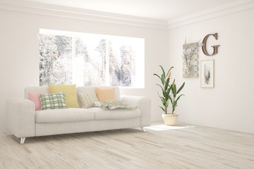 White living room with sofa and winter landscape in window. Scandinavian interior design. 3D illustration
