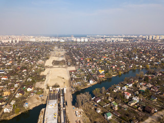 The construction of a bridge in Kiev across the Dnieper River. Aerial drone view.