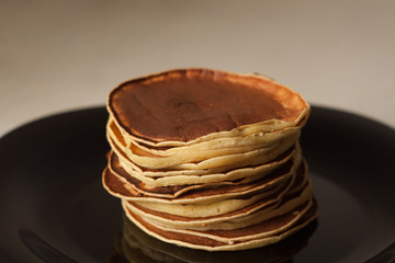 A Plate Of Pancakes with condensed milk