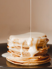 A Plate Of Pancakes with condensed milk