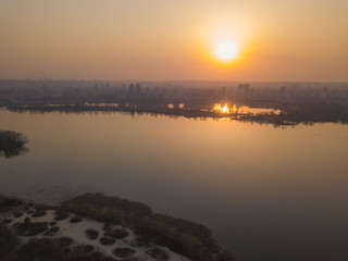 Sunset over the Dnieper River in Kiev. Aerial drone view.