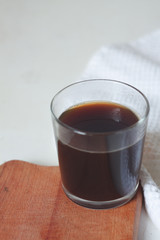 instant coffee in a glass on the kitchen table