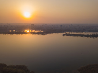 Naklejka premium Sunset over the Dnieper River in Kiev. Aerial drone view.