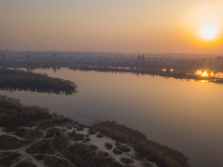 Fototapeta na wymiar Sunset over the Dnieper River in Kiev. Aerial drone view.