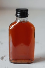 Cold brew coffee in bottle on grunge background