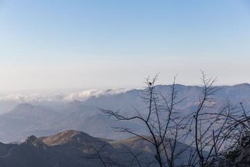 mountain landscape, on the horizon you can see the silhouettes of the mountains with different shades of blue