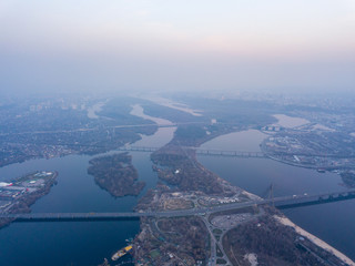 Landscape: blue hour over the Dnieper River in Kiev. Aerial drone view.