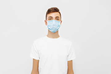 A young man wearing a medical mask to prevent infection, airborne respiratory disease, coronavirus isolated on a white background