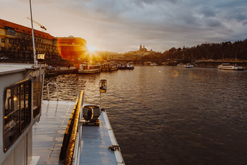 14.02.2020 Prague, Czech Republic: Prague during evening twilight, photo with view of Charles Bridge from deck of cruise ship sailing on Vltava river