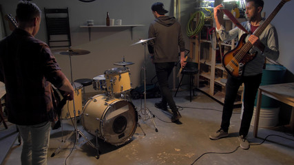 Musicians prepare for rehearsal in the garage