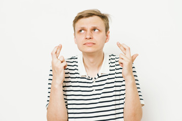 man crosses his fingers. Good luck, hope