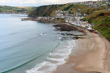 GARDENSTOWN, SCOTLAND - 2016 OCTOBER 22. Top view over Gardenstown village with the beautiful beach.
