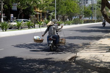 Asian biker with a rocker and two buckets