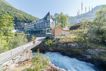 GEIRANGER, NORWAY - 2016 JUNE 14. Hotel Unionen with the Storfossen waterfall in front