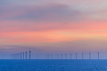 HORNSEA OFFSHORE WIND FARM, UK - 2016 JULY 15. Calm and relaxing sunset at the Wind Farm.