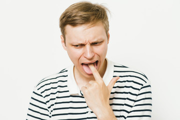 male of European appearance causes vomiting putting his fingers in his mouth on a , nausea