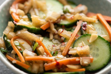 close up of tasty korean cucumber kimchi in bowl