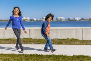 The sister and brother duo dance with a unique, passionate swag along the path by the seawall....