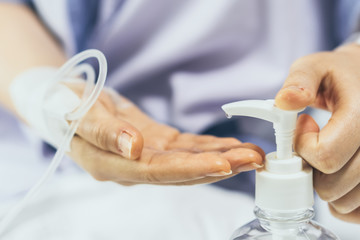 Blur background of hand clean washing launded with alcohol gel sanitizer pump in hospital to kill coronavirus germ flu. Hygiene protection coma serious weak patient such as elder, kids from illness