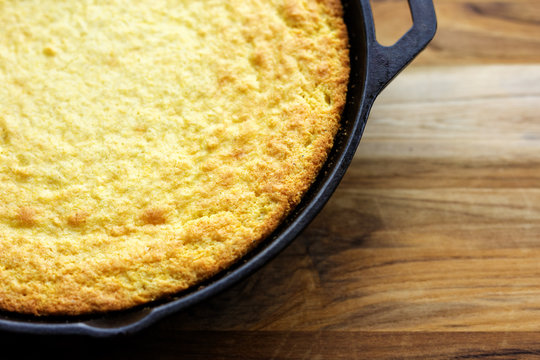 Homemade Southern style cornbread baked in a cast iron skillet. 