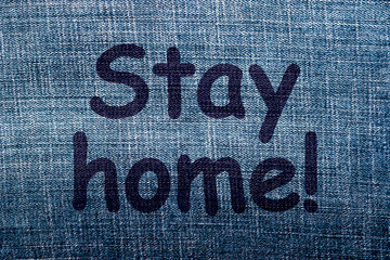  Stay home! - phrase on a background of blue denim