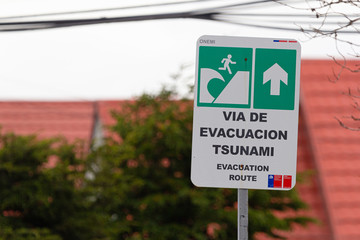 PUNTA ARENAS, CHILE - January 2020: Sign of Tsunami Alert - Evacuation Route