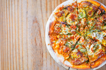 Traditional Italian Pizza on wooden plate.Slice of pizza cheese crust seafood topping sauce  delicious tasty fast food