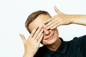 Man closes eyes with her hands