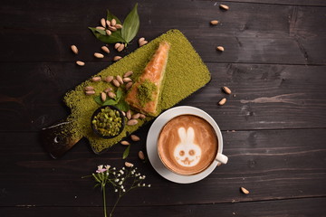 Turkish baklava with cappuccino and carrot sliced ​​peanuts