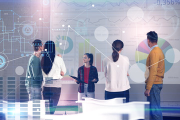Business trainer giving lecture using video projector in conference room and digital schemes. Double exposure