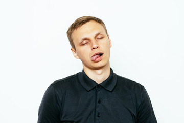 Fototapeta premium Man shows tongue